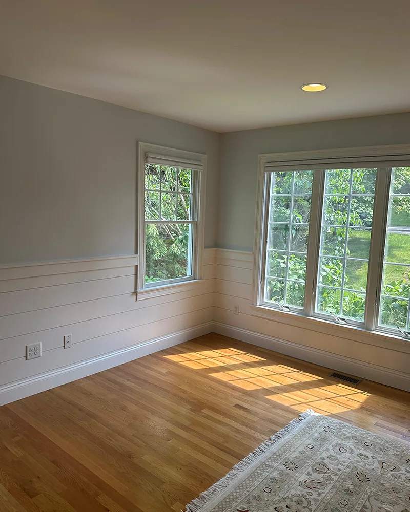 Cape Cod Dining Room with Hardwood Flooring and Bright Window